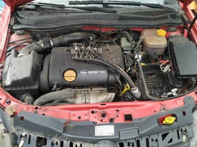 Красный Опель Астра, объемом двигателя 1.8 л и пробегом 215 тыс. км за 1950 $, фото 6 на Automoto.ua