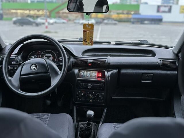 Красный Опель Астра, объемом двигателя 1.6 л и пробегом 400 тыс. км за 1299 $, фото 12 на Automoto.ua