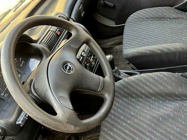 Червоний Опель Астра, об'ємом двигуна 1.4 л та пробігом 230 тис. км за 1000 $, фото 3 на Automoto.ua