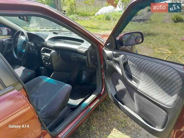 Красный Опель Астра, объемом двигателя 1.6 л и пробегом 223 тыс. км за 3300 $, фото 6 на Automoto.ua