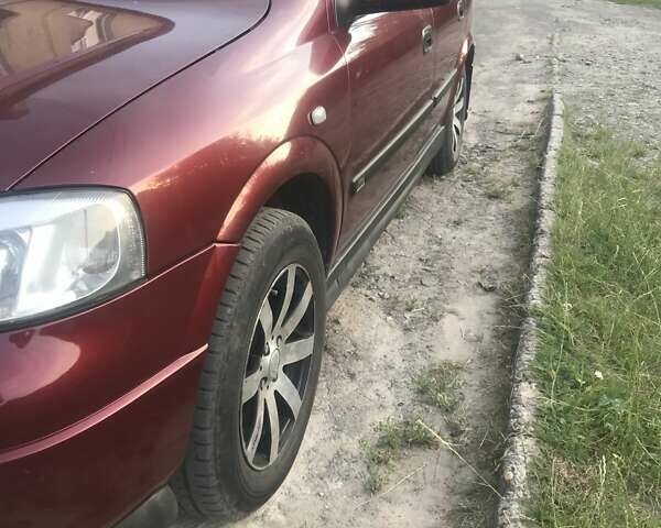 Красный Опель Астра, объемом двигателя 1.39 л и пробегом 290 тыс. км за 2400 $, фото 5 на Automoto.ua