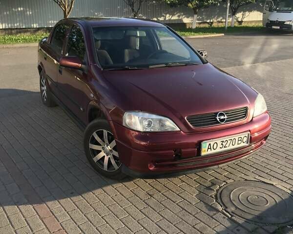 Красный Опель Астра, объемом двигателя 1.39 л и пробегом 290 тыс. км за 2400 $, фото 2 на Automoto.ua