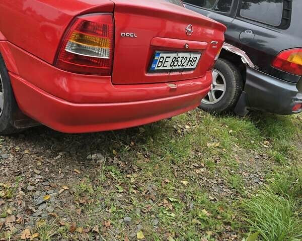 Красный Опель Астра, объемом двигателя 1.6 л и пробегом 345 тыс. км за 2990 $, фото 4 на Automoto.ua