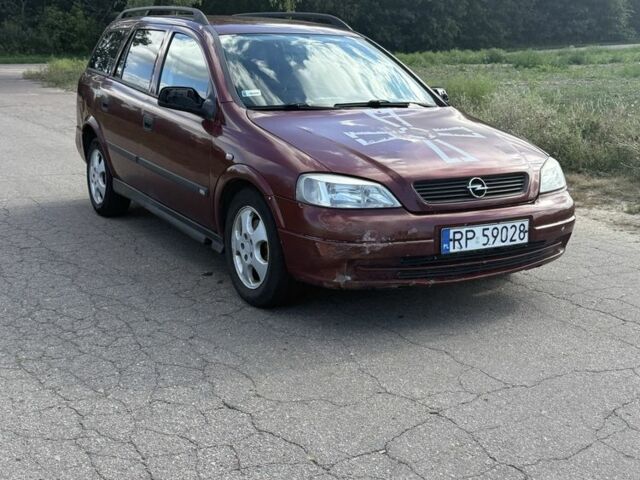 Красный Опель Астра, объемом двигателя 2 л и пробегом 300 тыс. км за 1250 $, фото 2 на Automoto.ua