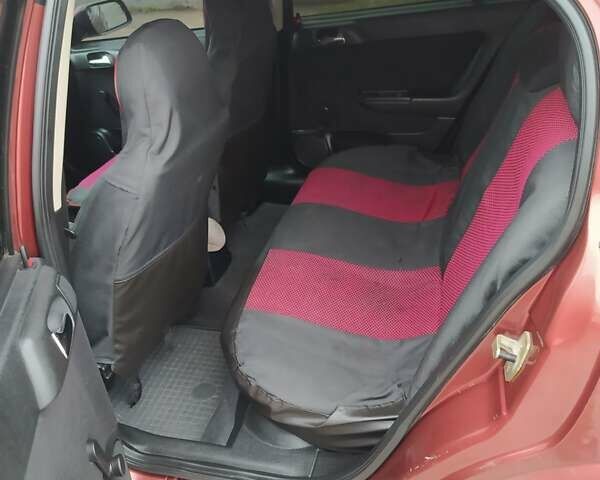 Красный Опель Астра, объемом двигателя 1.4 л и пробегом 210 тыс. км за 3400 $, фото 7 на Automoto.ua
