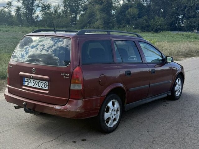 Красный Опель Астра, объемом двигателя 2 л и пробегом 300 тыс. км за 1250 $, фото 3 на Automoto.ua