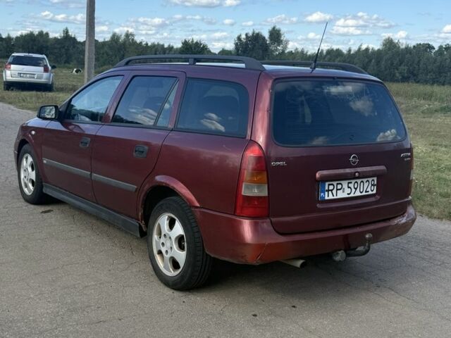 Красный Опель Астра, объемом двигателя 2 л и пробегом 300 тыс. км за 1250 $, фото 4 на Automoto.ua
