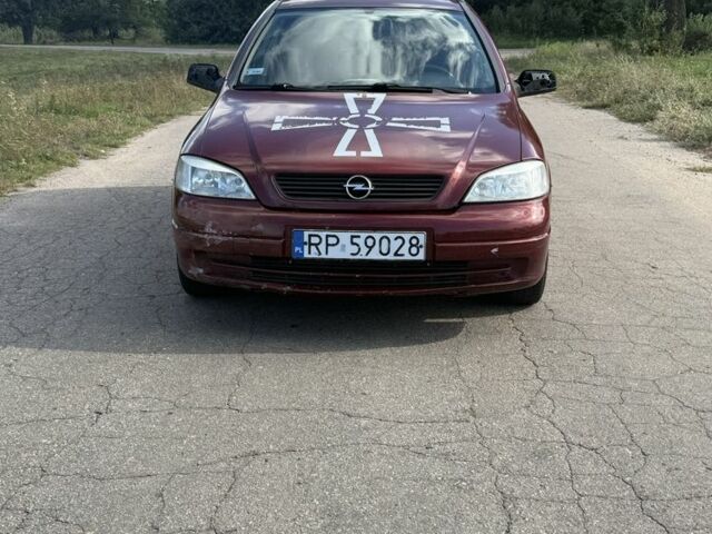 Красный Опель Астра, объемом двигателя 2 л и пробегом 300 тыс. км за 1250 $, фото 1 на Automoto.ua