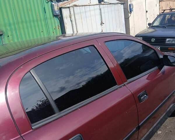 Червоний Опель Астра, об'ємом двигуна 1.4 л та пробігом 247 тис. км за 2300 $, фото 24 на Automoto.ua