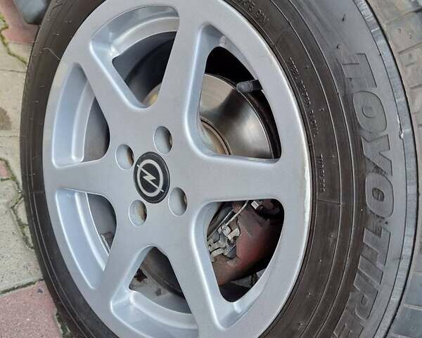 Красный Опель Астра, объемом двигателя 1.6 л и пробегом 224 тыс. км за 4500 $, фото 9 на Automoto.ua