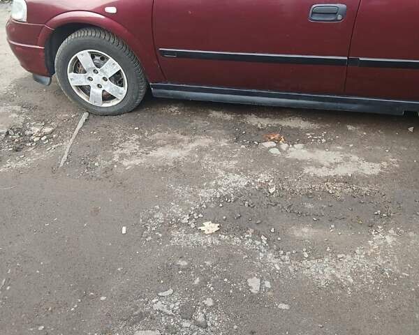 Червоний Опель Астра, об'ємом двигуна 1.4 л та пробігом 247 тис. км за 2300 $, фото 4 на Automoto.ua
