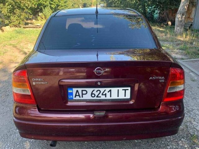 Красный Опель Астра, объемом двигателя 1.6 л и пробегом 285 тыс. км за 3000 $, фото 4 на Automoto.ua