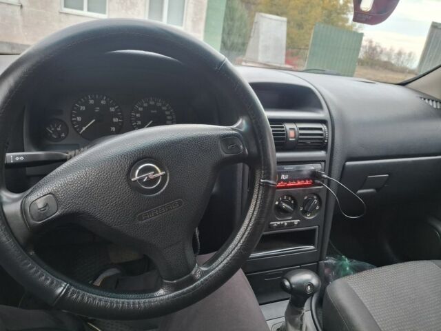 Червоний Опель Астра, об'ємом двигуна 1 л та пробігом 230 тис. км за 4000 $, фото 6 на Automoto.ua