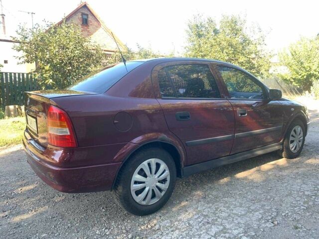Красный Опель Астра, объемом двигателя 1.6 л и пробегом 285 тыс. км за 3000 $, фото 3 на Automoto.ua