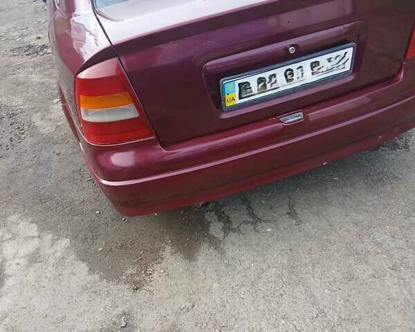 Червоний Опель Астра, об'ємом двигуна 1.4 л та пробігом 247 тис. км за 2300 $, фото 5 на Automoto.ua