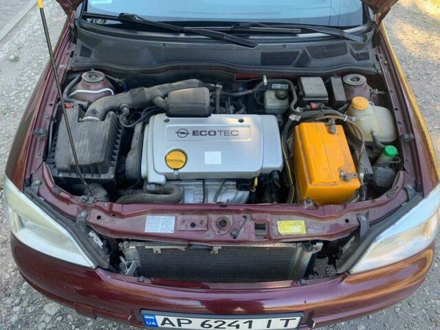 Красный Опель Астра, объемом двигателя 1.6 л и пробегом 285 тыс. км за 3000 $, фото 8 на Automoto.ua