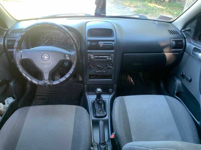 Красный Опель Астра, объемом двигателя 1.6 л и пробегом 285 тыс. км за 3000 $, фото 9 на Automoto.ua