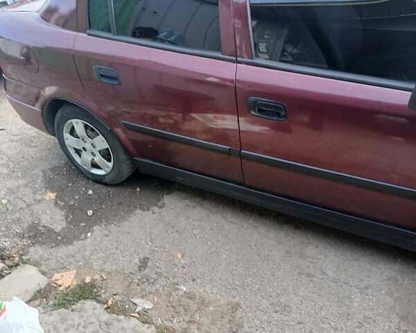 Червоний Опель Астра, об'ємом двигуна 1.4 л та пробігом 247 тис. км за 2300 $, фото 1 на Automoto.ua