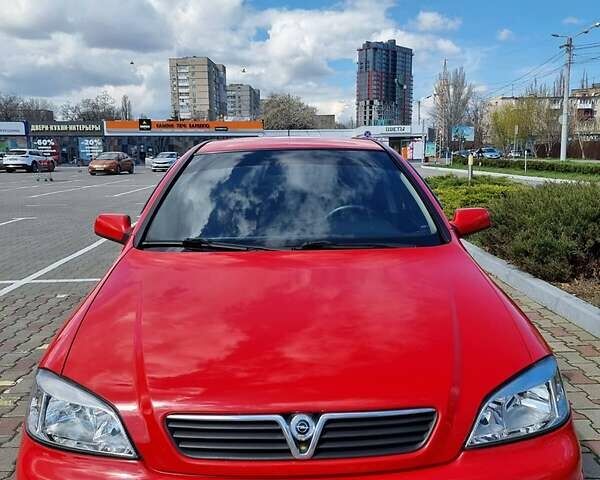 Красный Опель Астра, объемом двигателя 1.6 л и пробегом 224 тыс. км за 4500 $, фото 1 на Automoto.ua