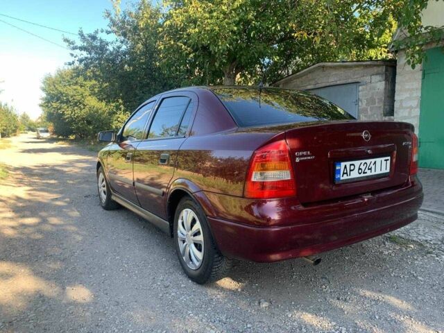 Красный Опель Астра, объемом двигателя 1.6 л и пробегом 285 тыс. км за 3000 $, фото 5 на Automoto.ua