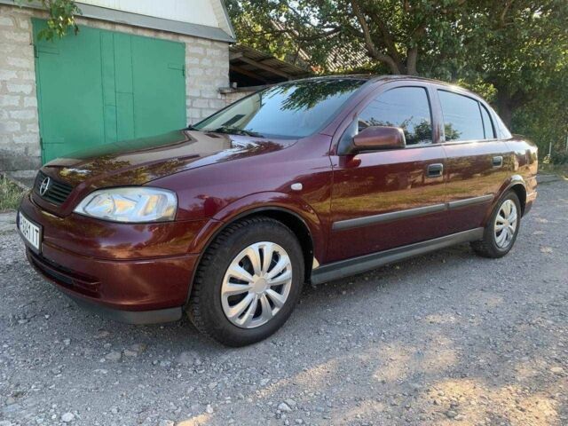 Красный Опель Астра, объемом двигателя 1.6 л и пробегом 285 тыс. км за 3000 $, фото 7 на Automoto.ua