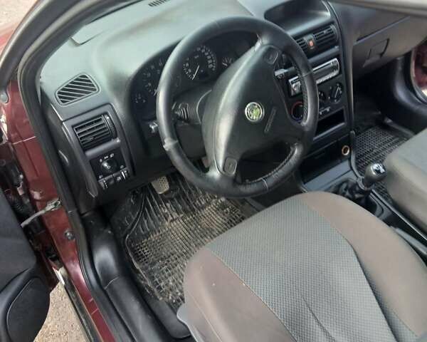 Червоний Опель Астра, об'ємом двигуна 1.4 л та пробігом 247 тис. км за 2300 $, фото 31 на Automoto.ua