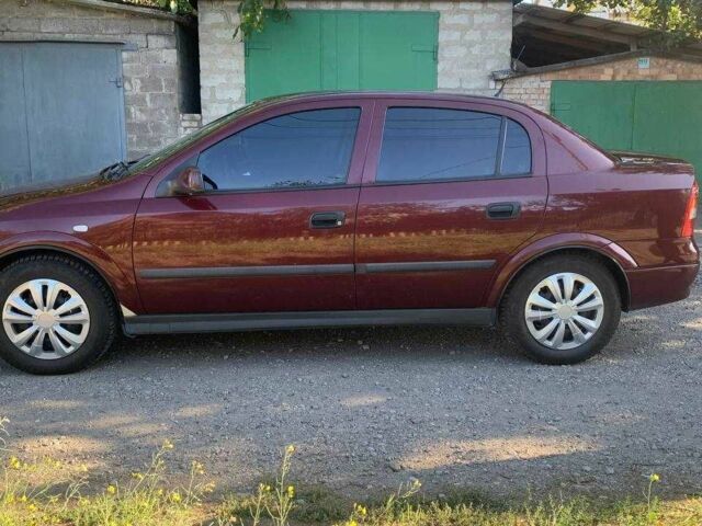Красный Опель Астра, объемом двигателя 1.6 л и пробегом 285 тыс. км за 3000 $, фото 6 на Automoto.ua