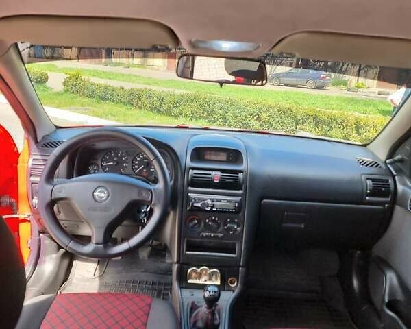 Красный Опель Астра, объемом двигателя 1.6 л и пробегом 224 тыс. км за 4500 $, фото 4 на Automoto.ua