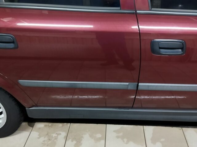 Красный Опель Астра, объемом двигателя 1.4 л и пробегом 420 тыс. км за 3200 $, фото 2 на Automoto.ua