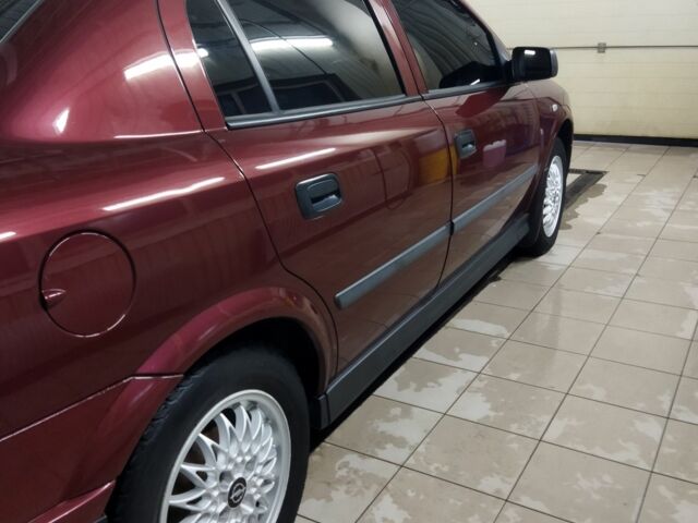 Красный Опель Астра, объемом двигателя 1.4 л и пробегом 420 тыс. км за 3200 $, фото 1 на Automoto.ua