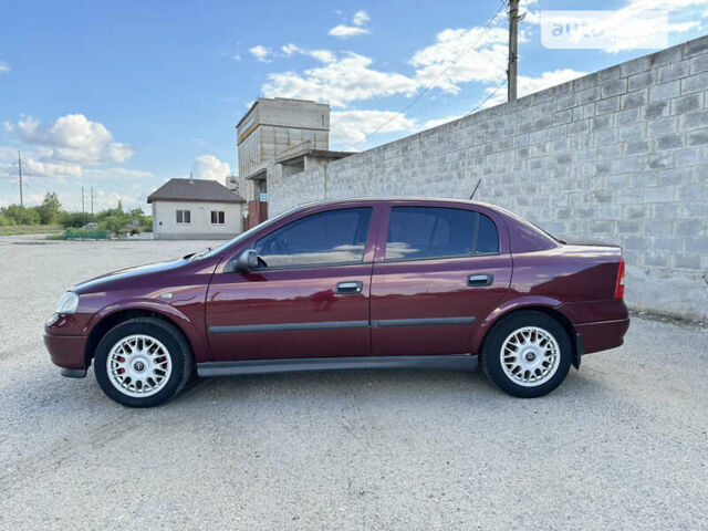 Красный Опель Астра, объемом двигателя 1.4 л и пробегом 183 тыс. км за 4200 $, фото 2 на Automoto.ua