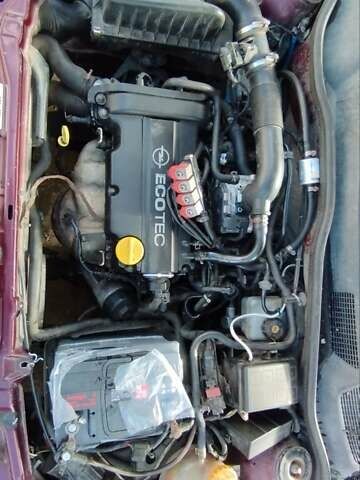 Красный Опель Астра, объемом двигателя 1.4 л и пробегом 297 тыс. км за 2500 $, фото 6 на Automoto.ua