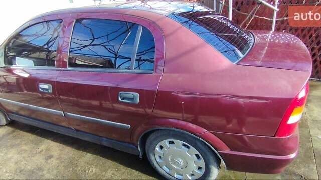 Красный Опель Астра, объемом двигателя 1.4 л и пробегом 297 тыс. км за 2500 $, фото 3 на Automoto.ua