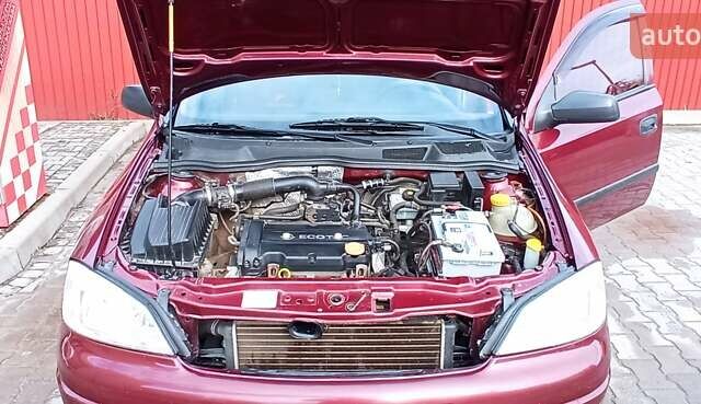 Червоний Опель Астра, об'ємом двигуна 1.4 л та пробігом 207 тис. км за 2500 $, фото 10 на Automoto.ua