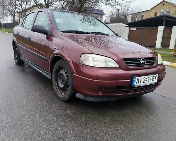 Красный Опель Астра, объемом двигателя 1.36 л и пробегом 327 тыс. км за 2900 $, фото 2 на Automoto.ua