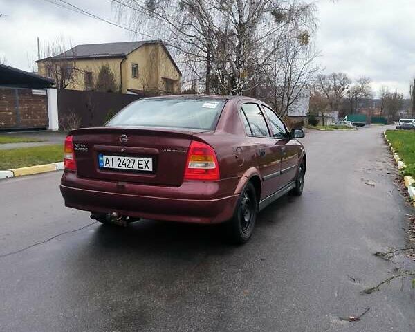 Красный Опель Астра, объемом двигателя 1.36 л и пробегом 327 тыс. км за 2900 $, фото 3 на Automoto.ua