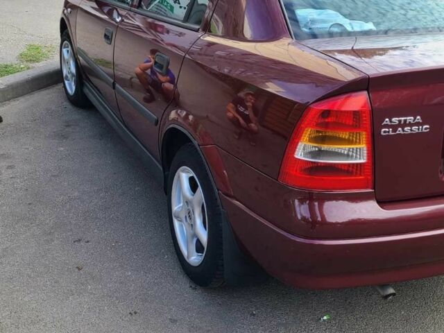 Красный Опель Астра, объемом двигателя 1.4 л и пробегом 226 тыс. км за 4500 $, фото 9 на Automoto.ua