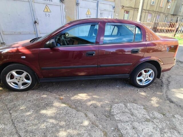 Красный Опель Астра, объемом двигателя 1.4 л и пробегом 226 тыс. км за 4500 $, фото 3 на Automoto.ua