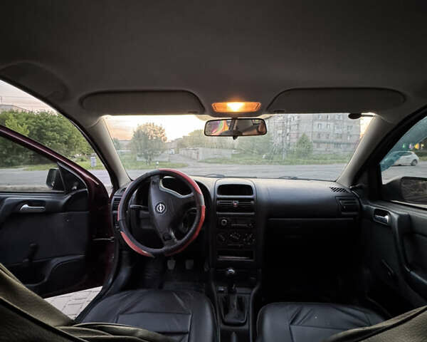 Червоний Опель Астра, об'ємом двигуна 1.4 л та пробігом 380 тис. км за 2850 $, фото 14 на Automoto.ua