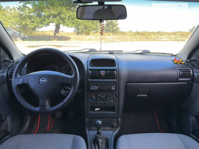 Красный Опель Астра, объемом двигателя 1.4 л и пробегом 183 тыс. км за 4200 $, фото 9 на Automoto.ua