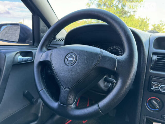 Красный Опель Астра, объемом двигателя 1.4 л и пробегом 183 тыс. км за 4200 $, фото 10 на Automoto.ua