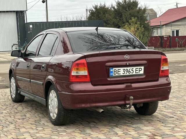 Красный Опель Астра, объемом двигателя 1.4 л и пробегом 245 тыс. км за 3400 $, фото 3 на Automoto.ua
