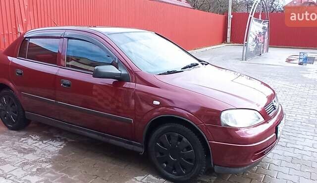 Червоний Опель Астра, об'ємом двигуна 1.4 л та пробігом 207 тис. км за 2500 $, фото 1 на Automoto.ua