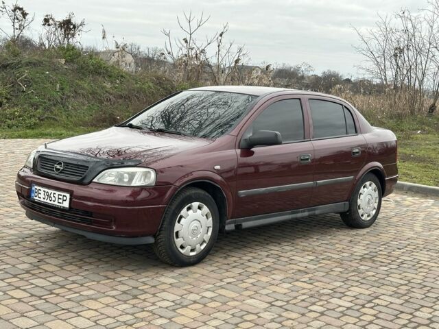 Красный Опель Астра, объемом двигателя 1.4 л и пробегом 245 тыс. км за 3400 $, фото 4 на Automoto.ua