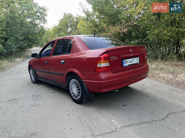 Красный Опель Астра, объемом двигателя 1.4 л и пробегом 315 тыс. км за 3000 $, фото 2 на Automoto.ua