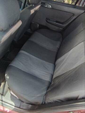 Красный Опель Астра, объемом двигателя 1.4 л и пробегом 297 тыс. км за 2500 $, фото 5 на Automoto.ua