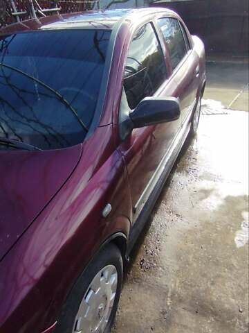 Красный Опель Астра, объемом двигателя 1.4 л и пробегом 297 тыс. км за 2500 $, фото 2 на Automoto.ua