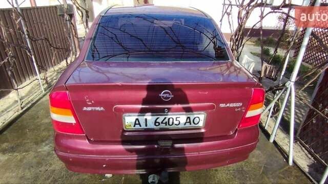 Красный Опель Астра, объемом двигателя 1.4 л и пробегом 297 тыс. км за 2500 $, фото 9 на Automoto.ua