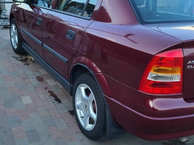 Красный Опель Астра, объемом двигателя 1.4 л и пробегом 226 тыс. км за 4500 $, фото 4 на Automoto.ua