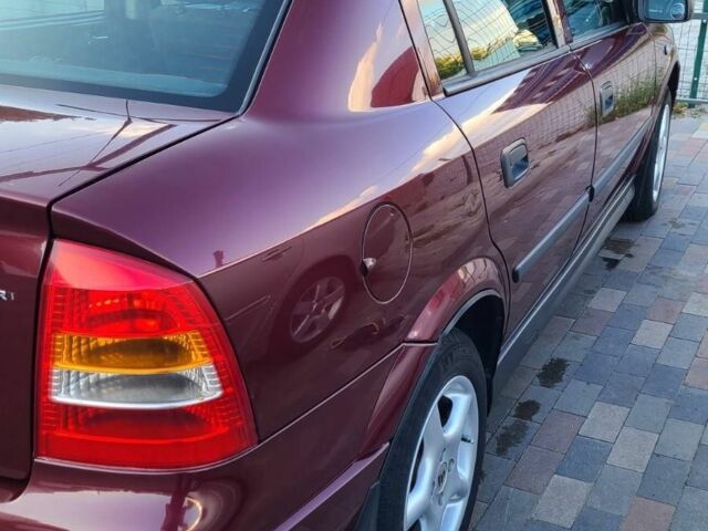 Красный Опель Астра, объемом двигателя 1.4 л и пробегом 226 тыс. км за 4500 $, фото 8 на Automoto.ua